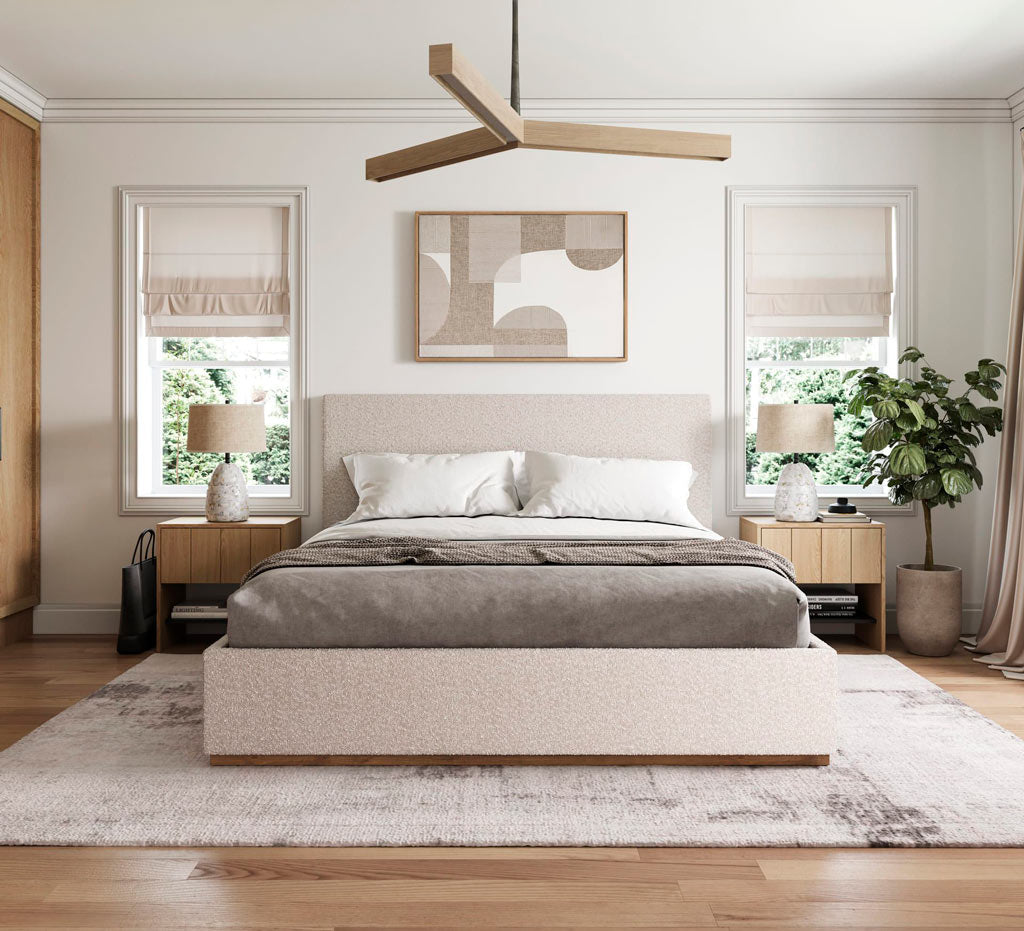 Modern bedroom with a bed, side tables, and abstract art on the wall.