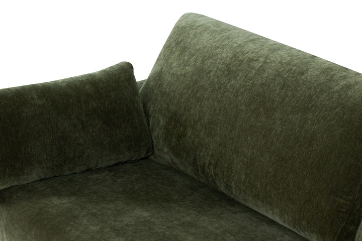 Green velvet corner sofa on a white background