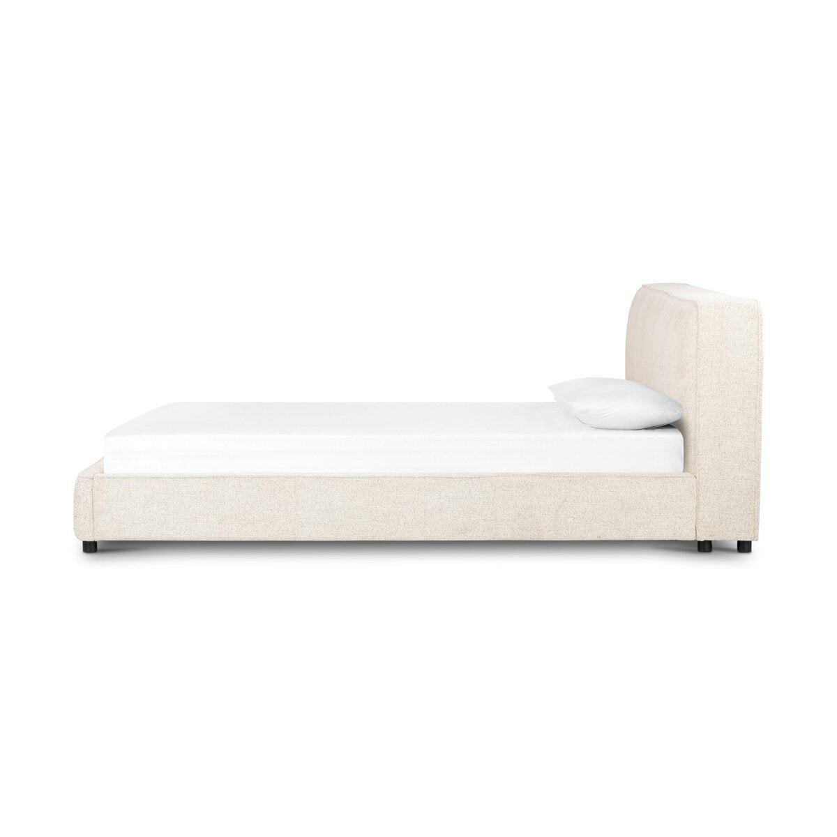 Beige upholstered bed with white mattress and pillow on a white background