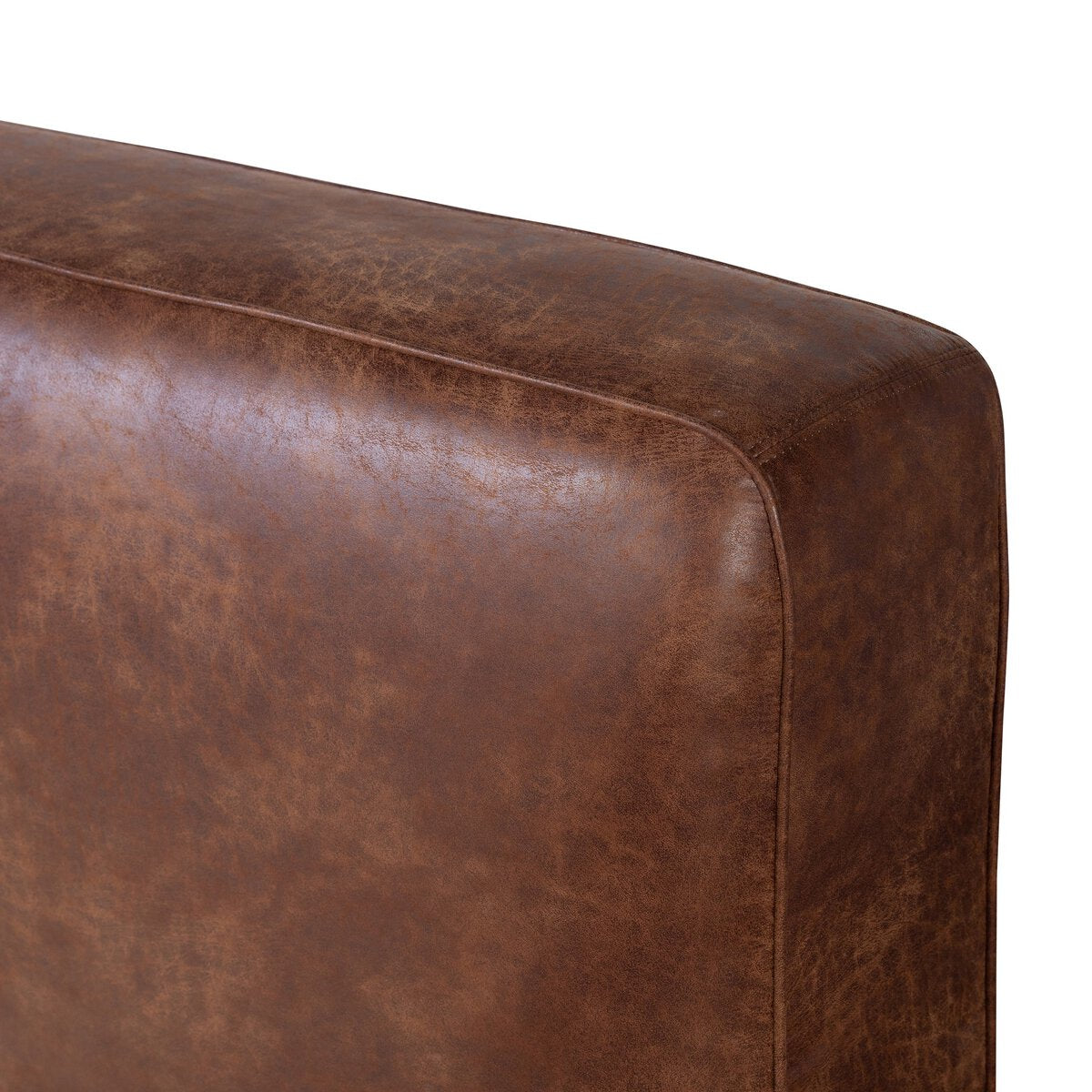 Aidan Bed Close-up of a brown leather armchair corner on a white background