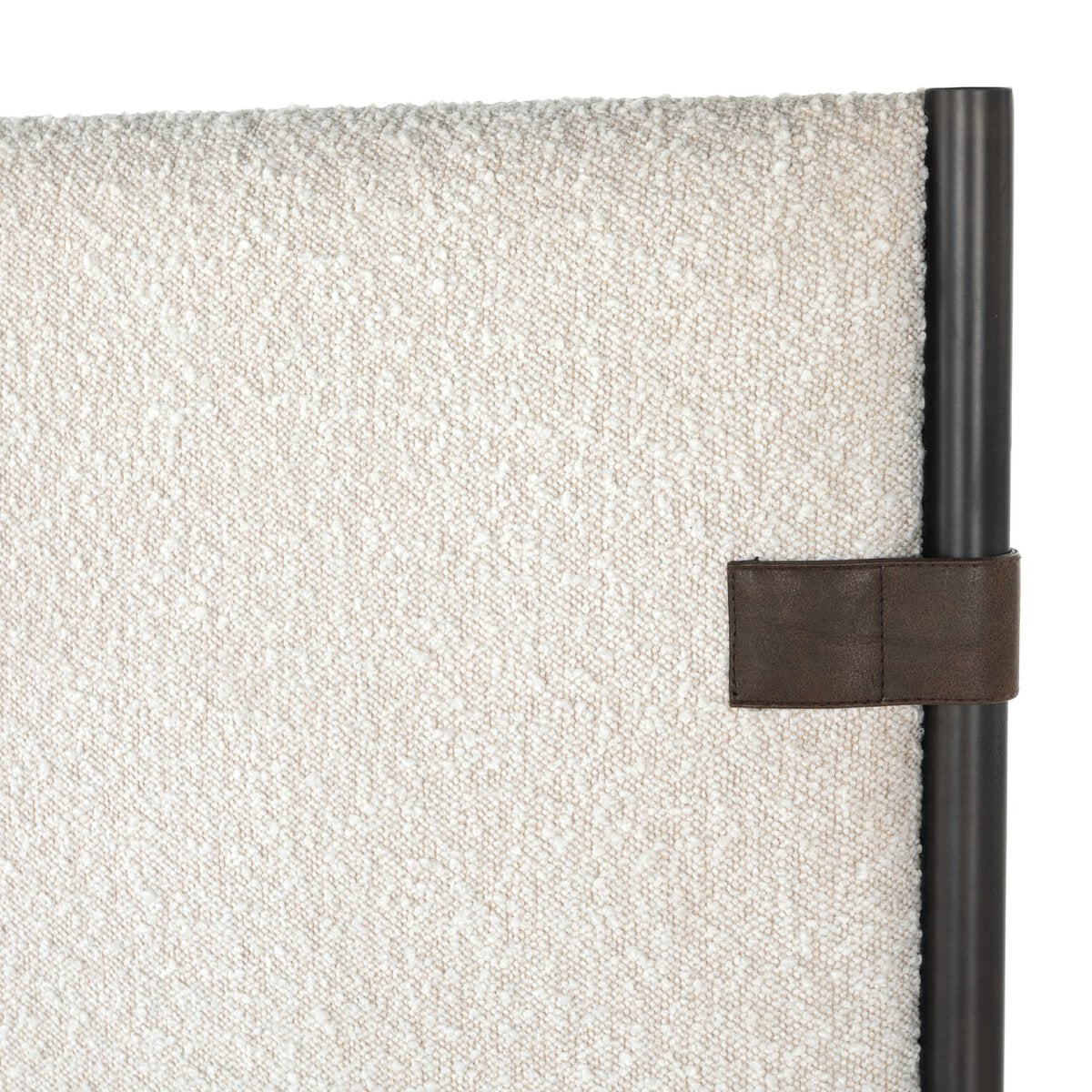 Textured wall panel with a leather strap and black frame