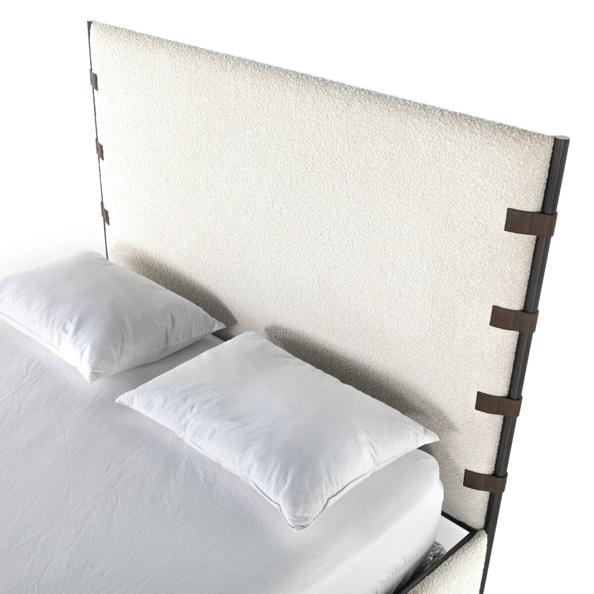 Anderson Bed with white bedding and a decorative headboard on a white background