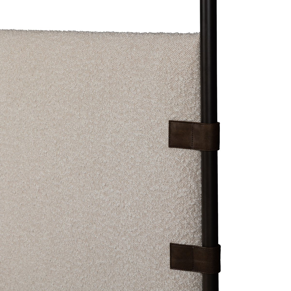 Close-up of a textured panel with a black strap attachment on a white background