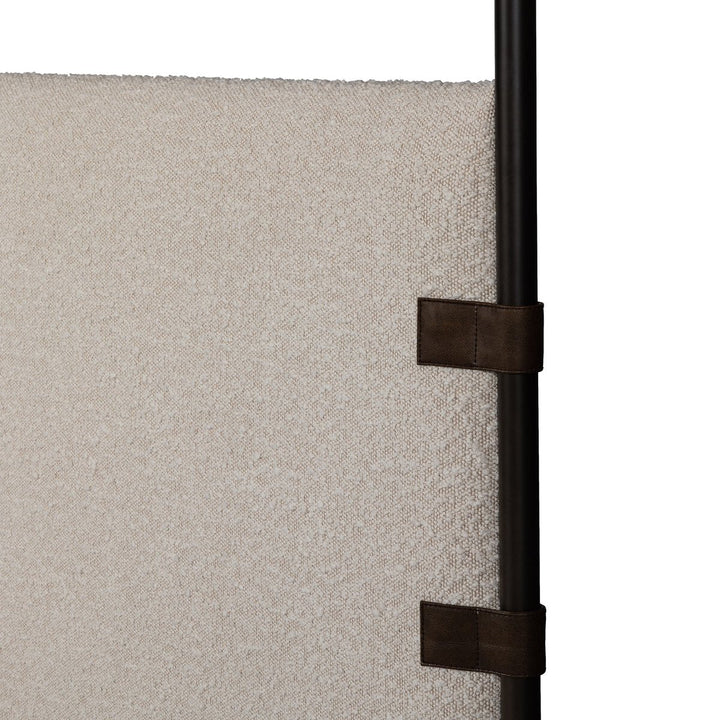Close-up of a textured panel with a black strap attachment on a white background