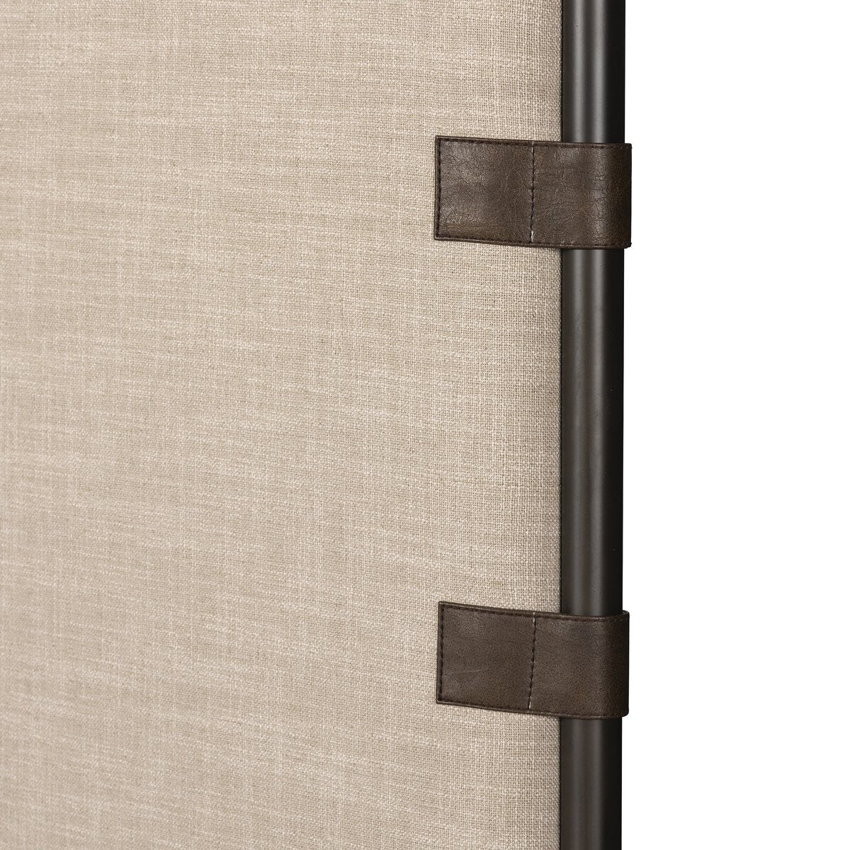 Close-up of a curtain rod with decorative straps on a beige background