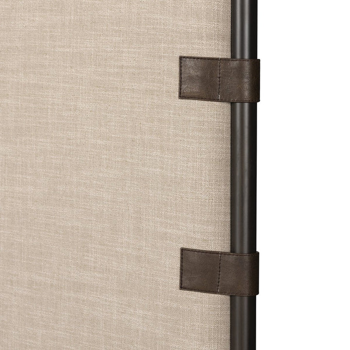 Close-up of a curtain rod with decorative straps on a beige background