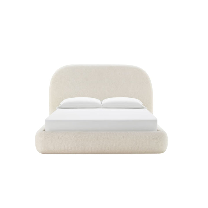 Close-up of Asher bed rounded headboard and soft fabric upholstery