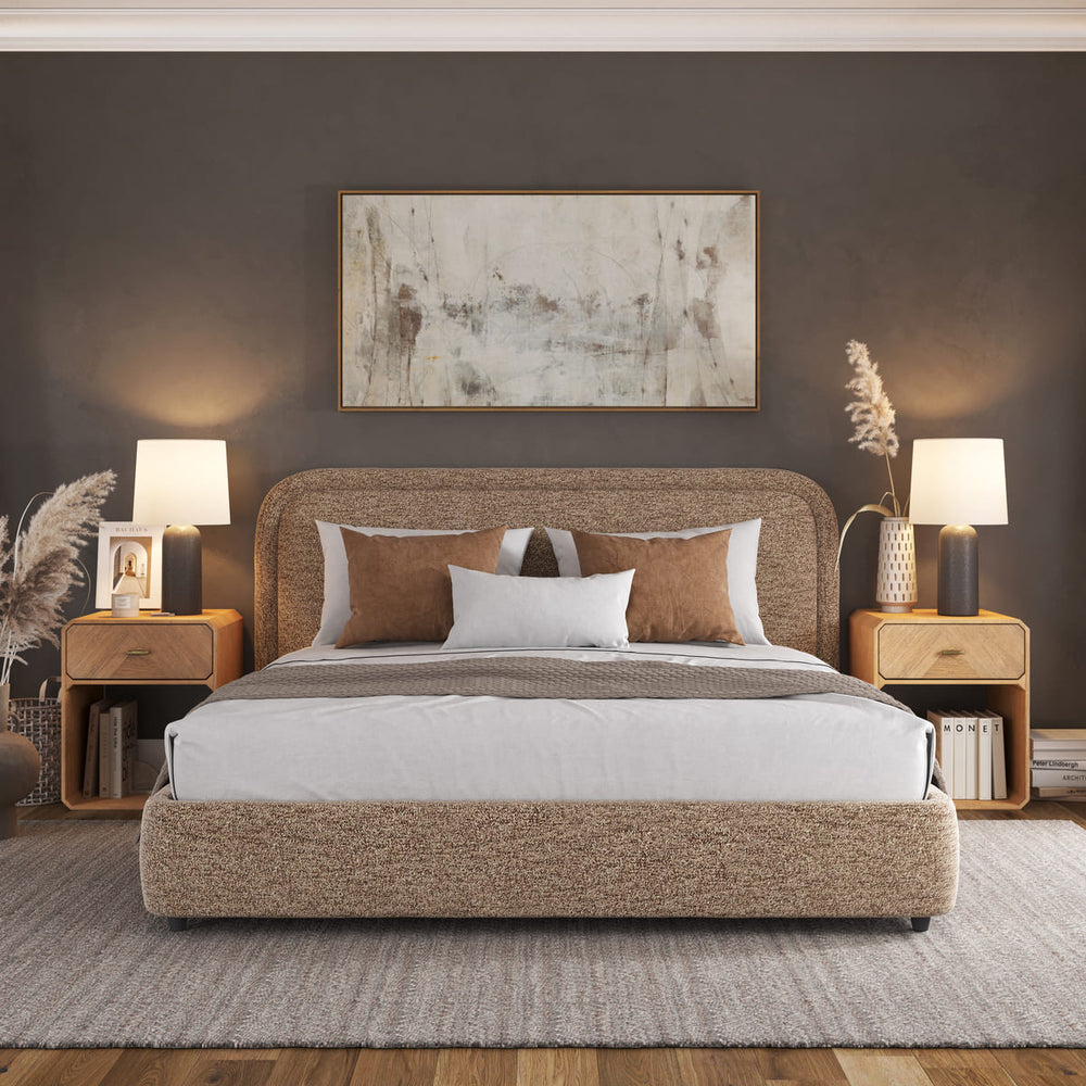 Modern bedroom with a bed, nightstands, and abstract art on the wall.