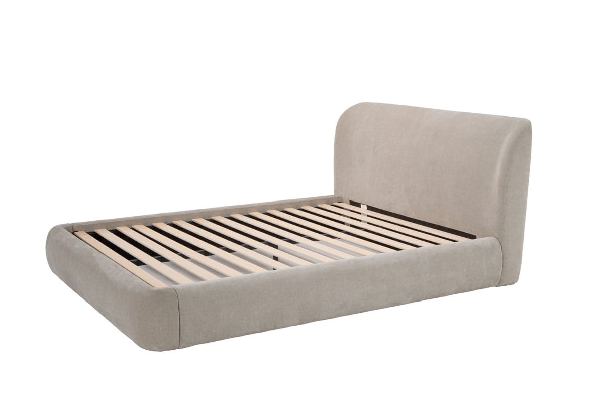 Beige upholstered bed frame on a white background