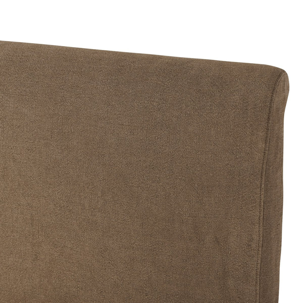 Close-up of a brown upholstered chair corner on a white background