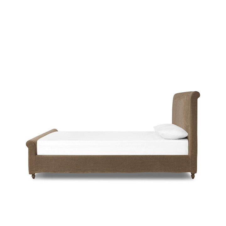 Bed with brown frame and white mattress on a white background