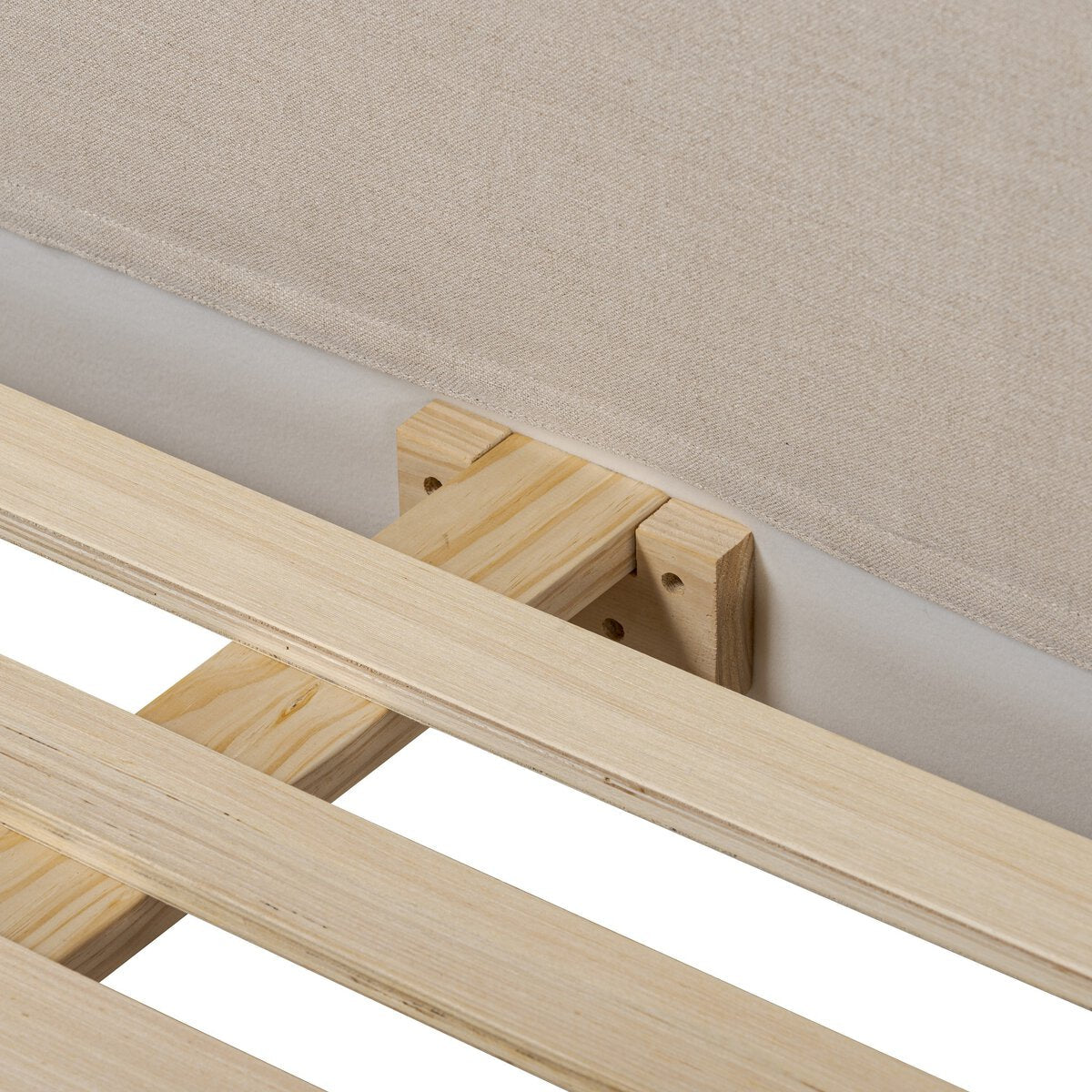 Wooden bed frame with slats against a neutral background