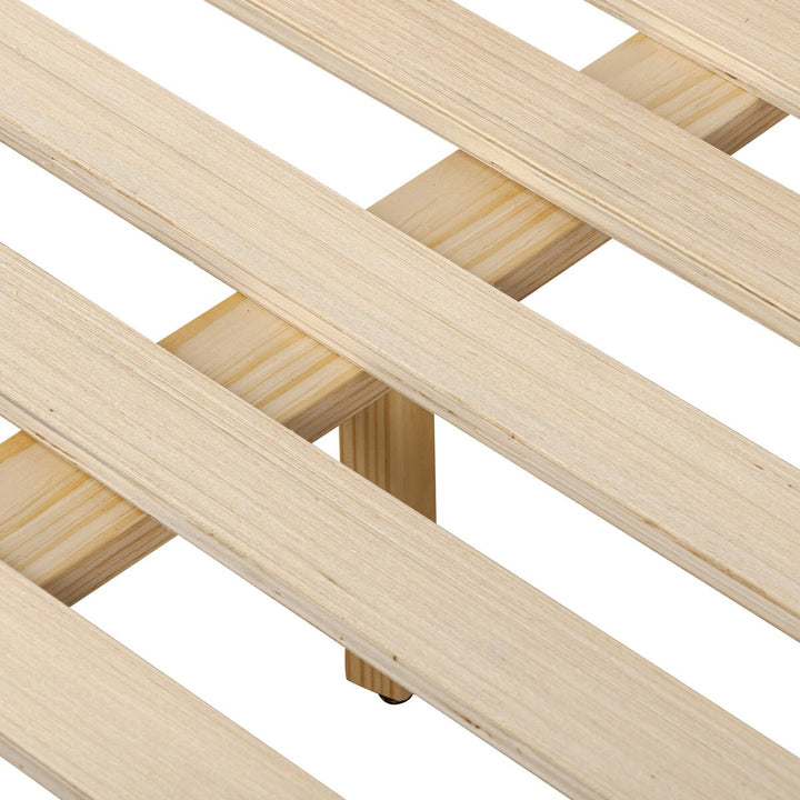 Close-up of a wooden lattice structure on a white background