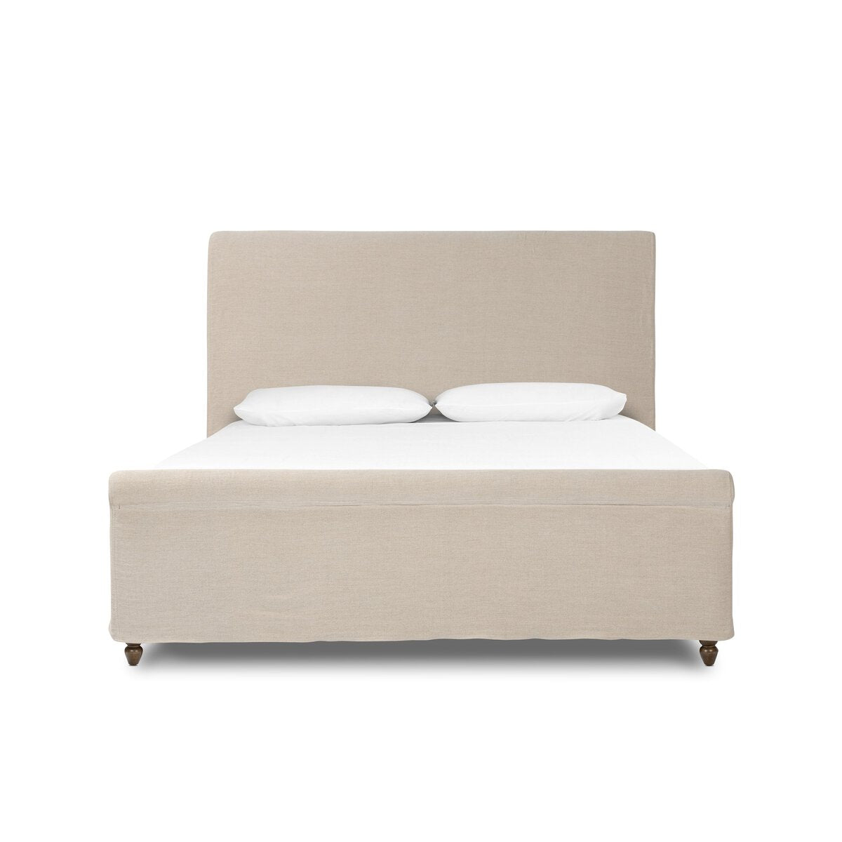 Beige upholstered bed with white bedding on a white background