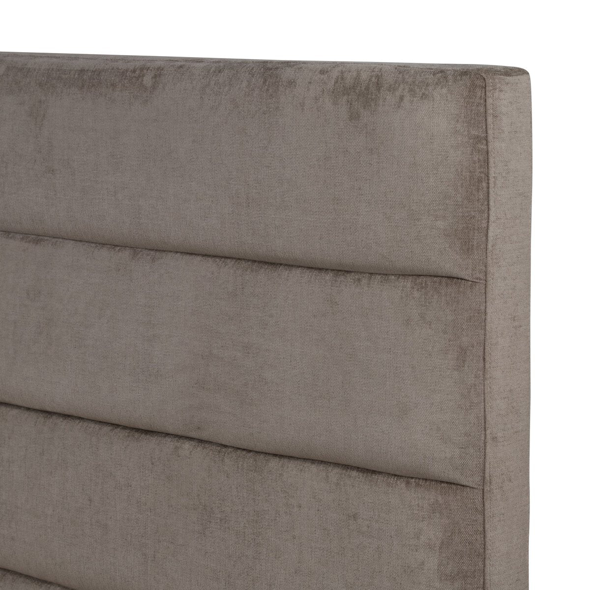 Gray upholstered headboard with a smooth texture on a white background