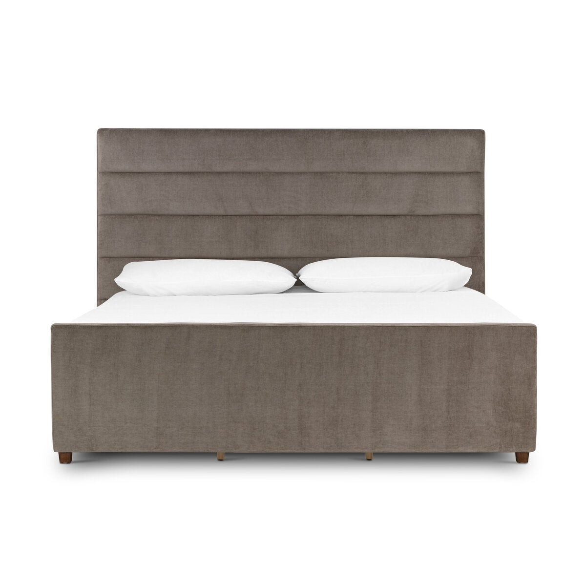 Gray upholstered bed with white bedding on a white background