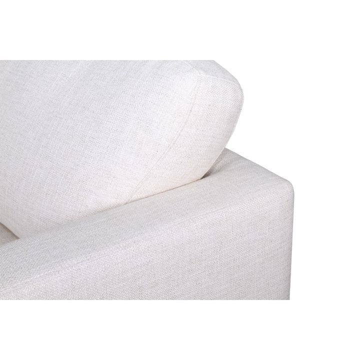 White fitted sheet on a bed with a white pillow