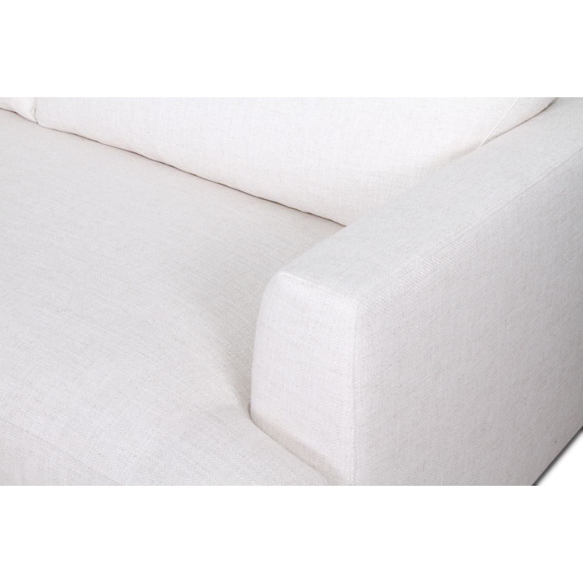 Close-up of a white mattress with a fitted sheet on a white background