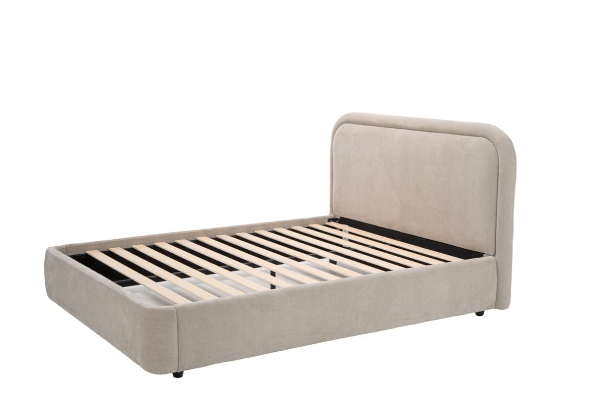 Beige upholstered bed frame with wooden slats on a white background
