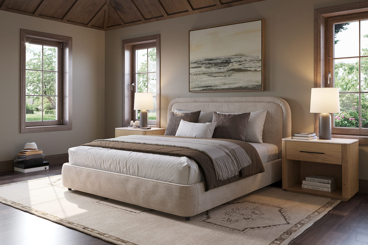 Neatly made bed in a bedroom with two nightstands and a lamp.