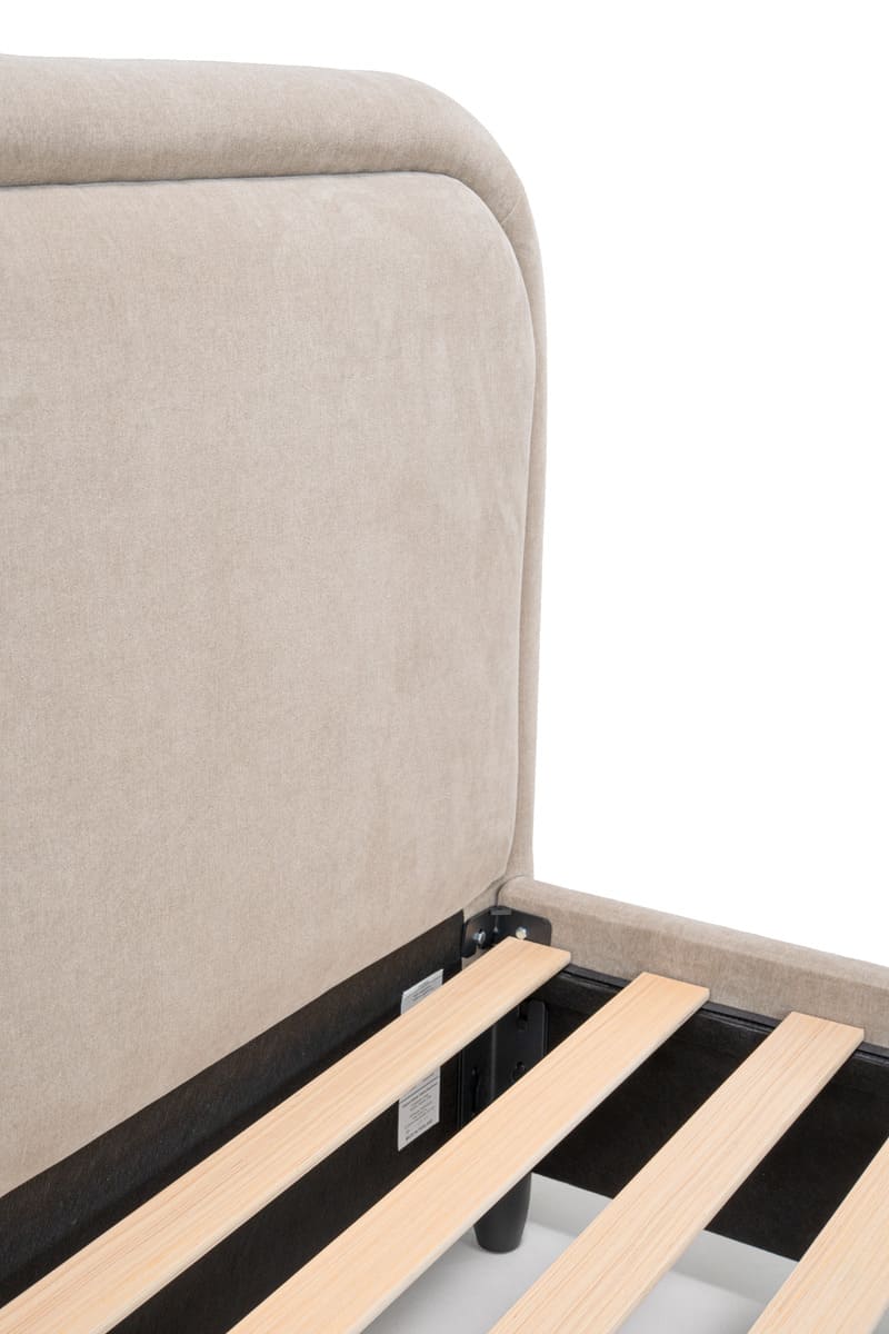 Beige upholstered bed frame with wooden slats on a white background
