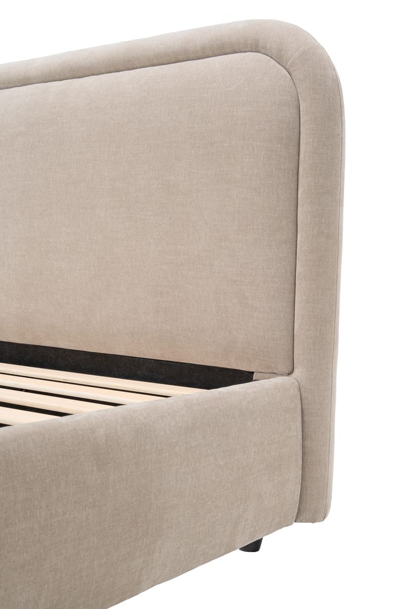 Beige upholstered bed frame with wooden slats on a white background