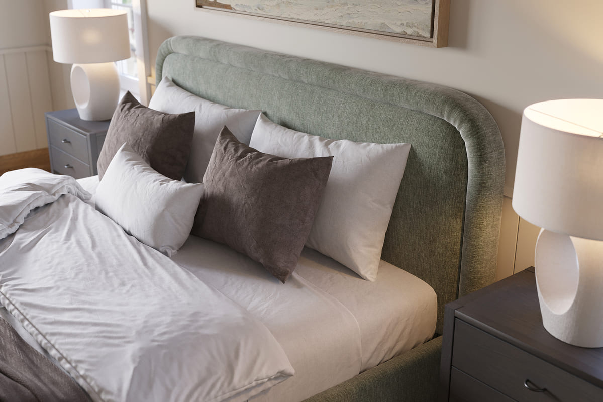 Bedroom with a bed featuring green headboard and white bedding, flanked by two lamps on nightstands.