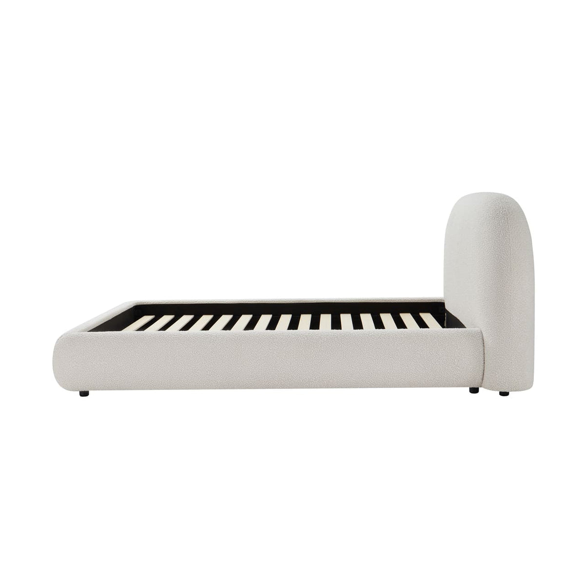 White upholstered bed frame with black slats on a white background