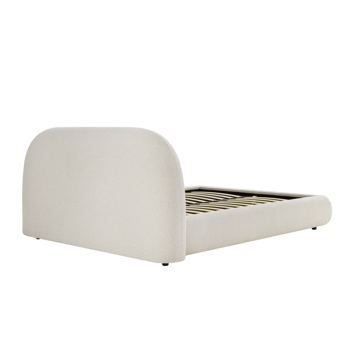 White upholstered bed frame on a white background