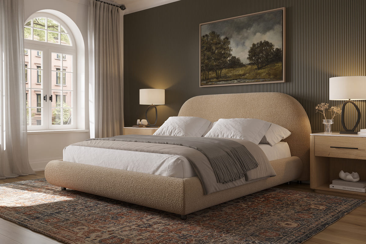 Modern bedroom with a beige upholstered bed, nightstands, and wall art.