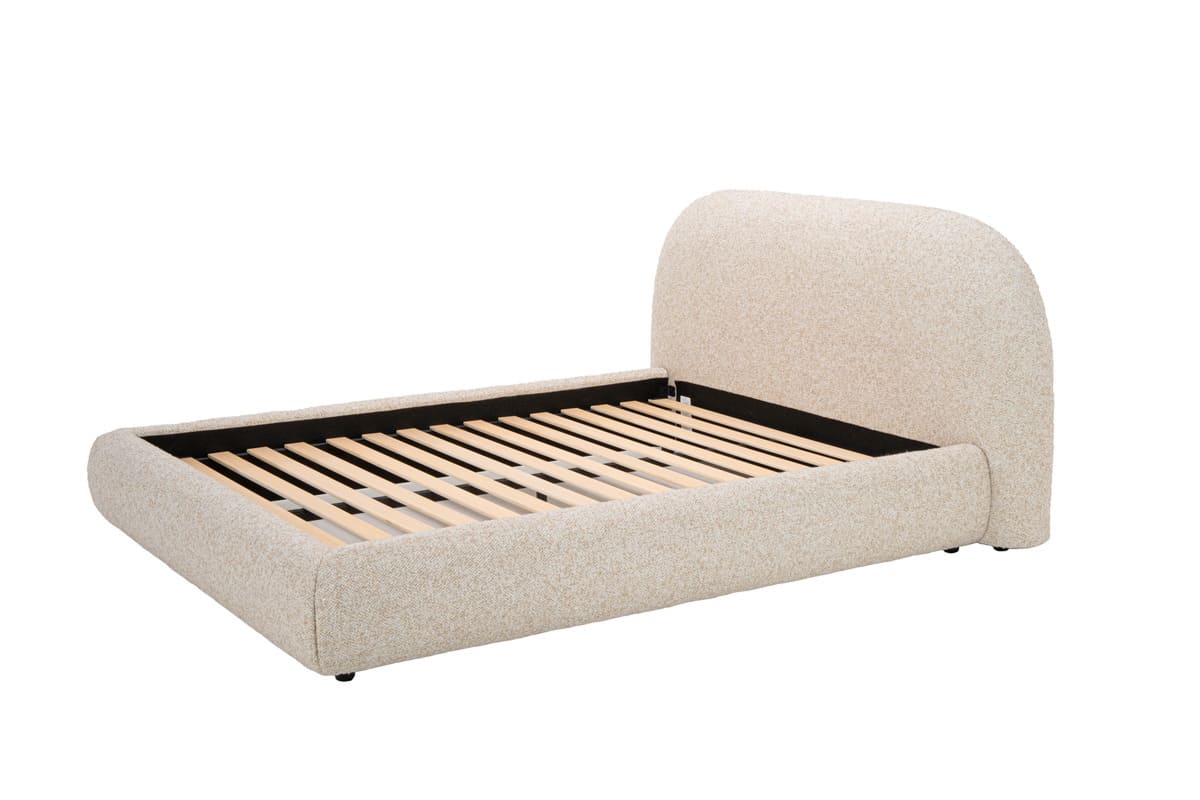 Beige upholstered bed frame with wooden slats on a white background
