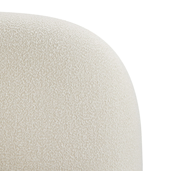 Close-up of a textured beige cushion on a white background