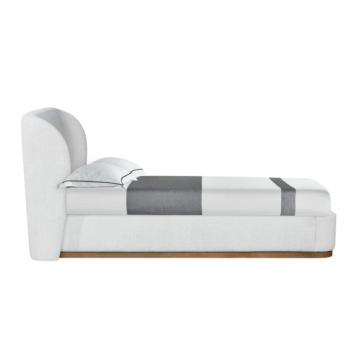 Modern white bed with gray striped blanket on a white background