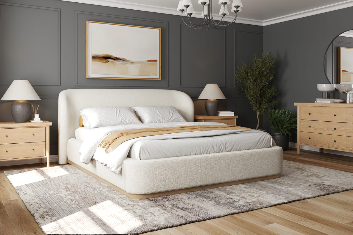 Modern bedroom with a bed, nightstands, and artwork on a gray wall.